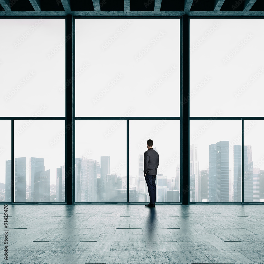 Fototapeta premium Businessman looking at the city
