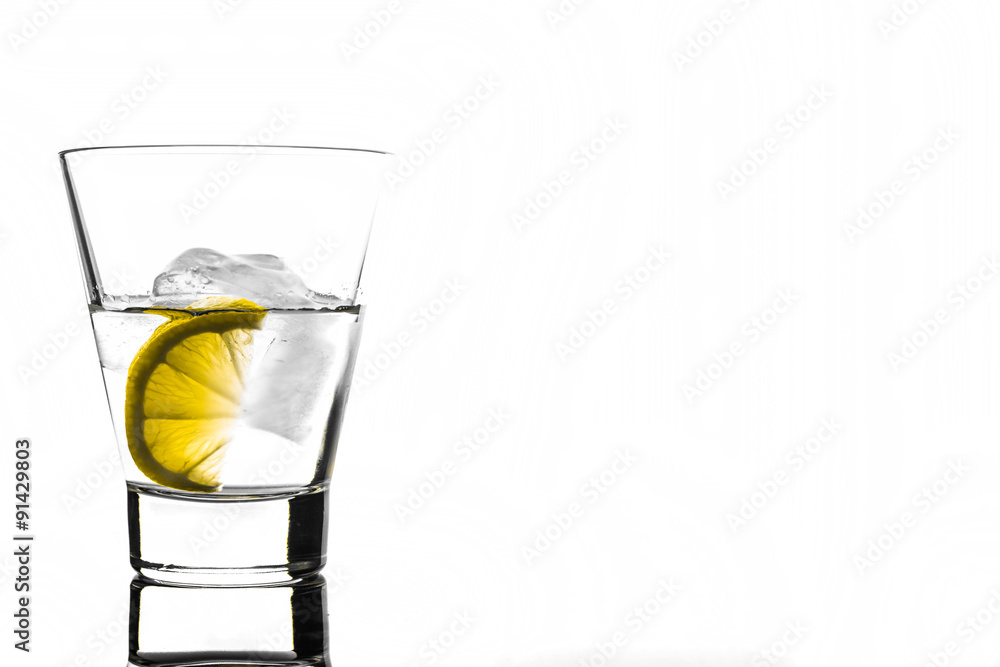 Beverage with lemon and ice in glass, isolated on white background Beverage with lemon and ice in glass, isolated on white background