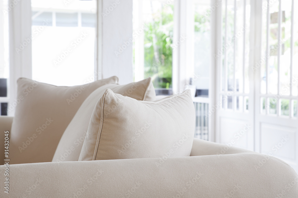 Close up pillows on gray sofa room interior decoration background,white and bright tone,copy space