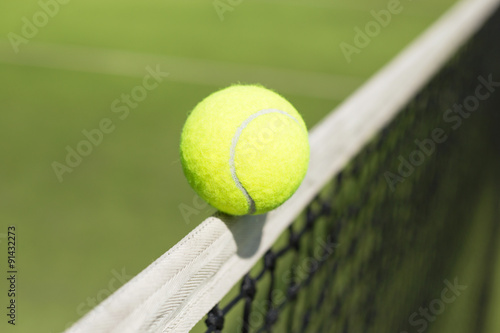Tennis ball hitting the net © Kaspars Grinvalds