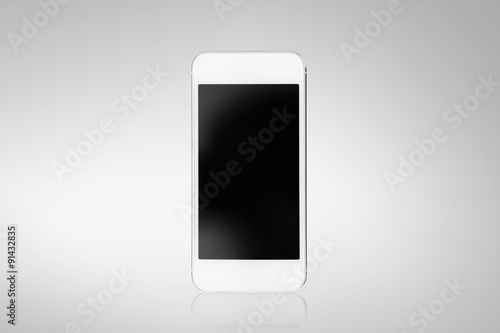 White smartphone on a gray background photo