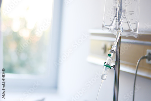 Intravenous drip or Perfusion recipient administrated in a hospital room photo
