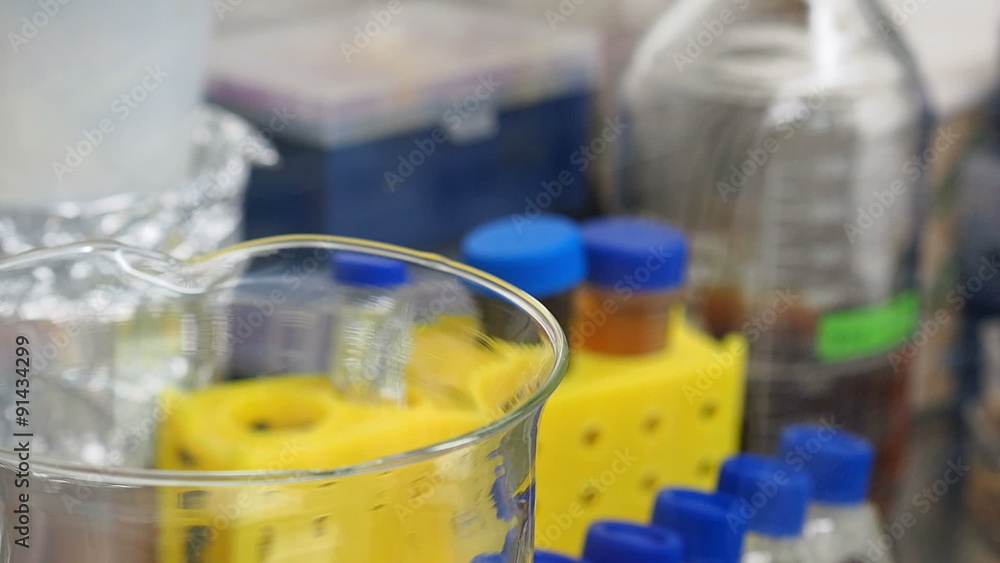 Researcher works in lab doing experiment Researcher works in lab doing experiment