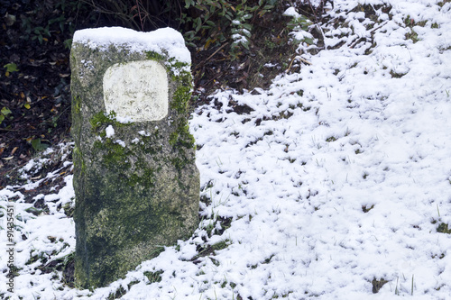 Sign in the covered with snow way