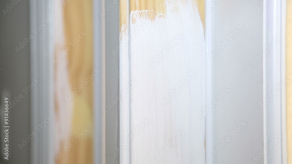Paint being applied to a doorframe - close up Paint being applied to a doorframe - close up