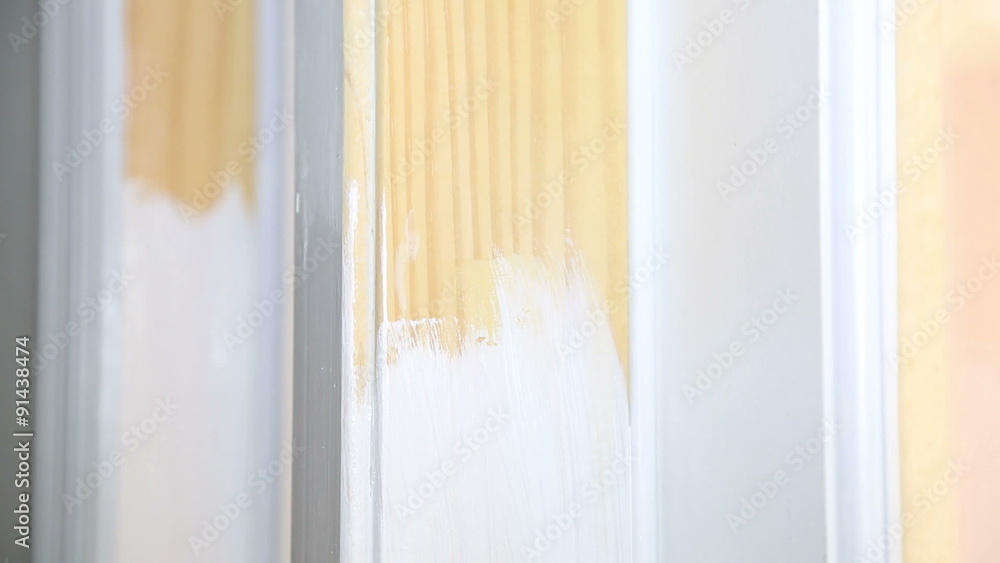 Paint being applied to a doorframe - close up Paint being applied to a doorframe - close up