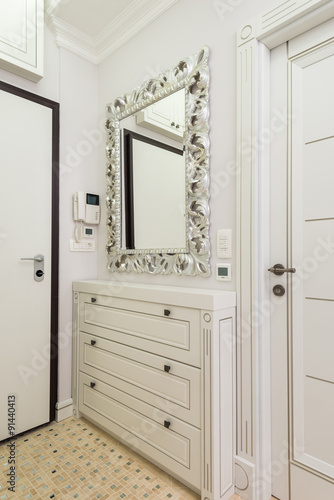 Shoe cabinet and mirror in the entryway