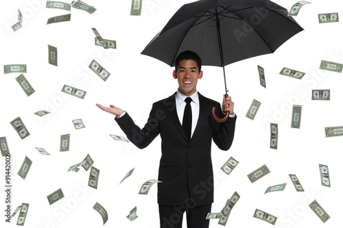 Half-body business man holding an umbrella in raining money with