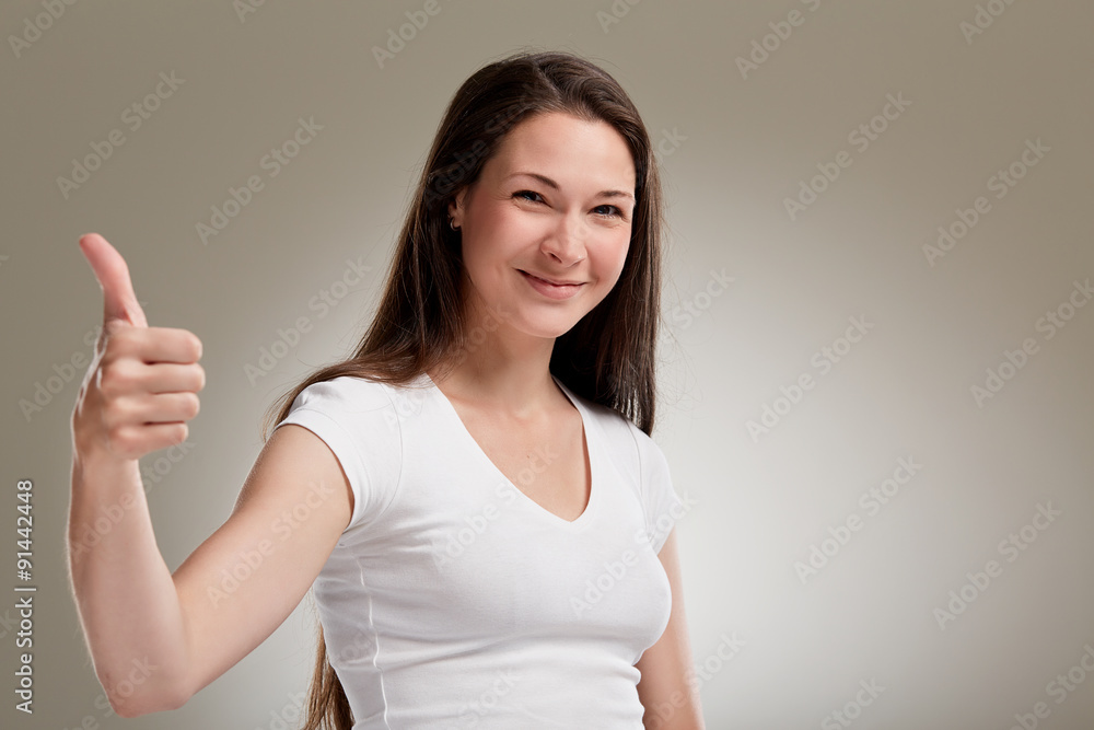 Portrait of 20s woman, thumb up Portrait of 20s woman, thumb up