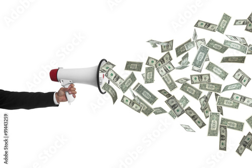 Arm holding megaphone speaking money