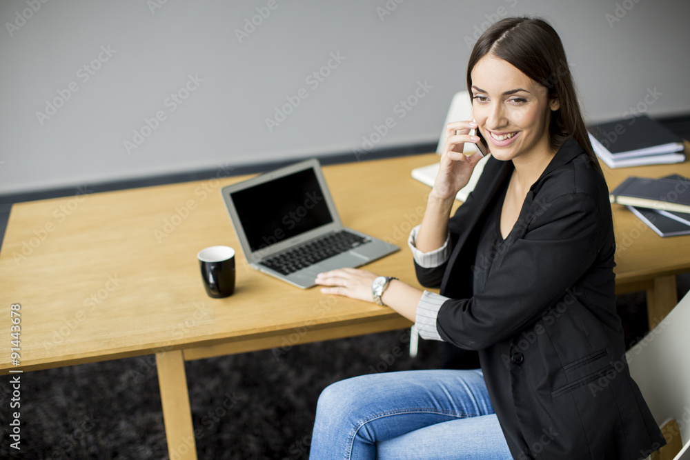 Young woman working in the office Young woman working in the office