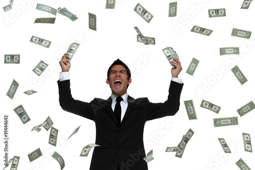 money raining on a celebrating business man photo