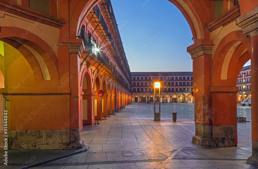 CORDOBA, SPAIN - MAY 27, 2015: The porticoes of Plaza de la Corredera square at dusk.