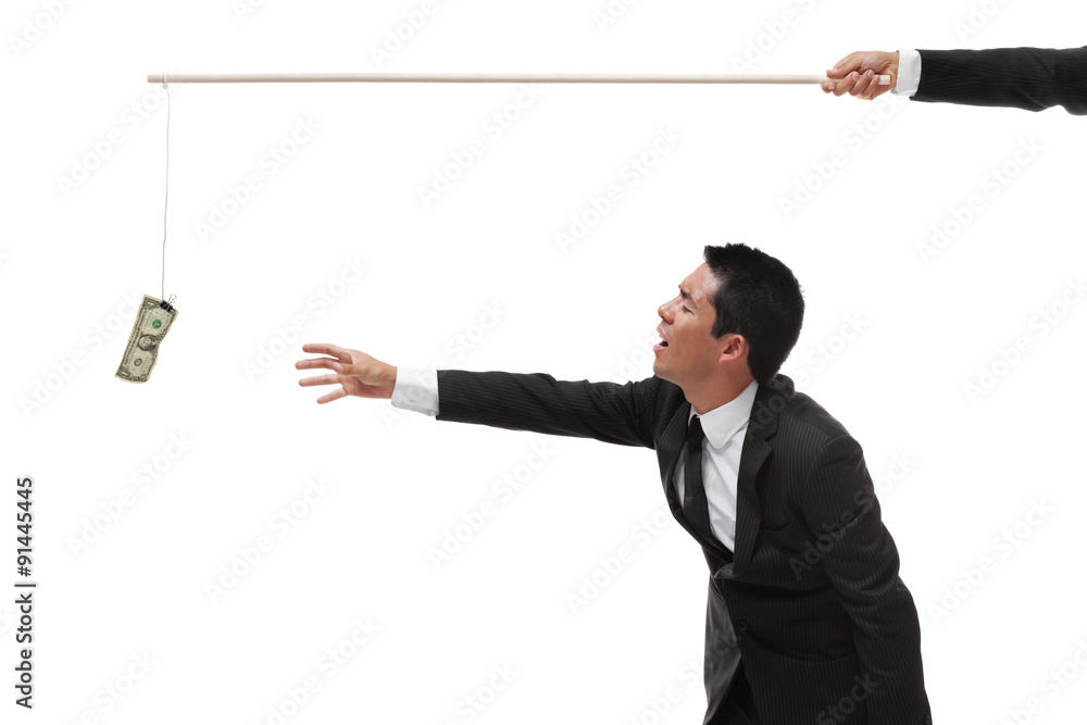 Exhausted Businessman reaching for money on the end of a stick Exhausted Businessman reaching for money on the end of a stick