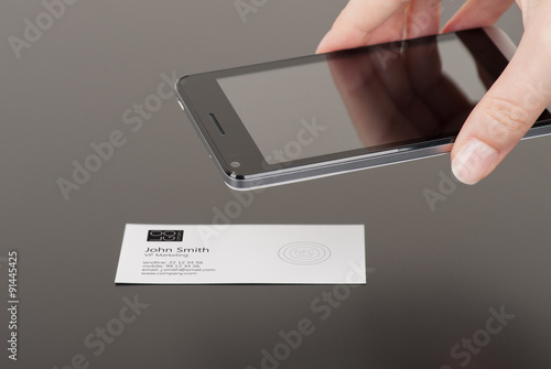 Business card with embedded NFC tag and phone photo