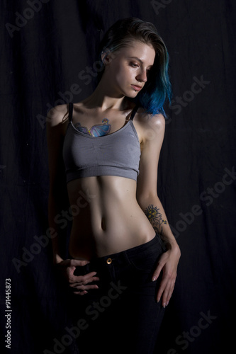 Blue haired girl pose in studio