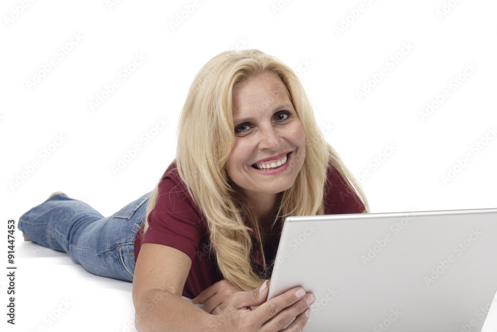 Woman Lying on Floor with Laptop Smiling at Camera Woman Lying on Floor with Laptop Smiling at Camera