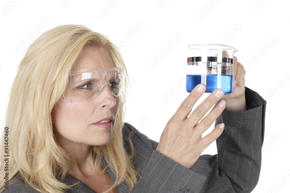 Scientist Examines Liquid in Beaker Scientist Examines Liquid in Beaker