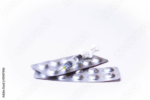 Medicine pills or capsules with syringe