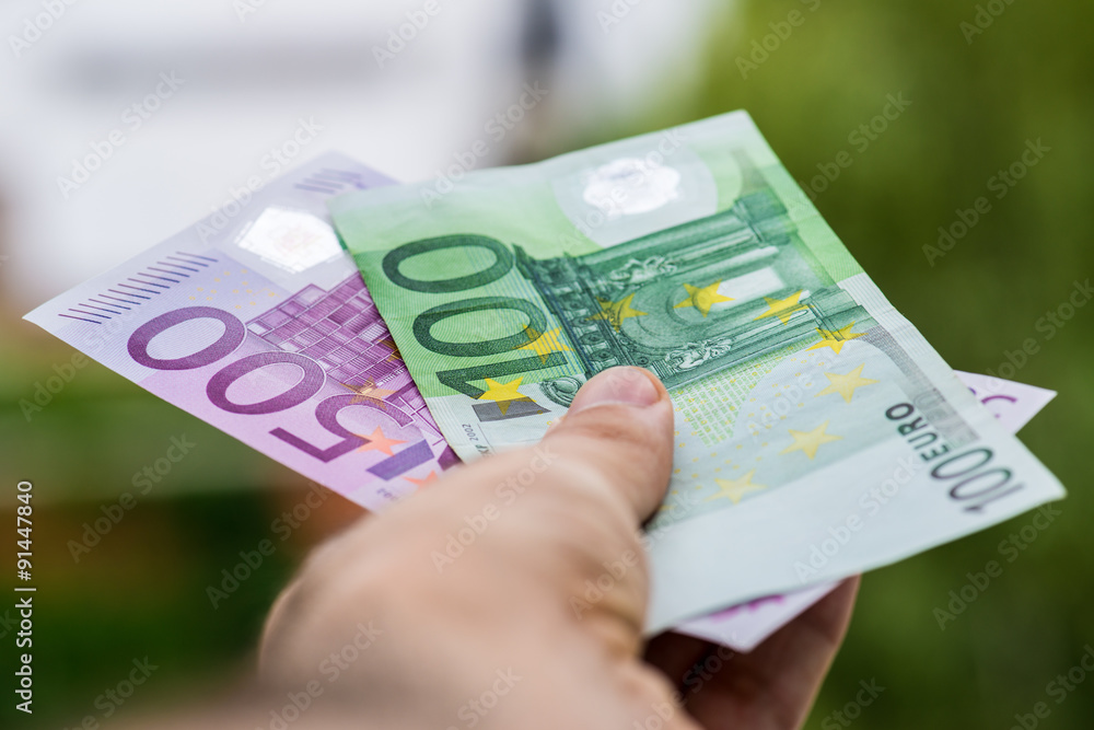 Man giving euro money