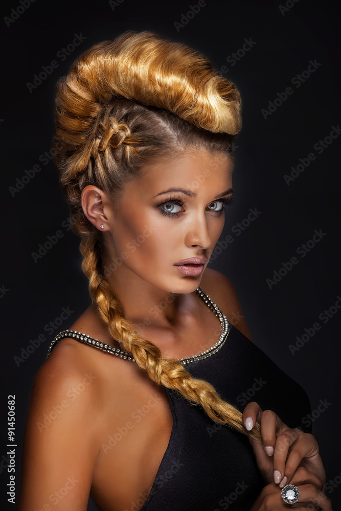 Portrait of blonde lady in creative hair.