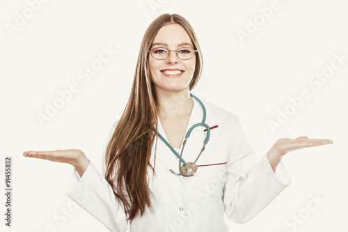 Happy woman doctor with empty hand palm copyspace. photo