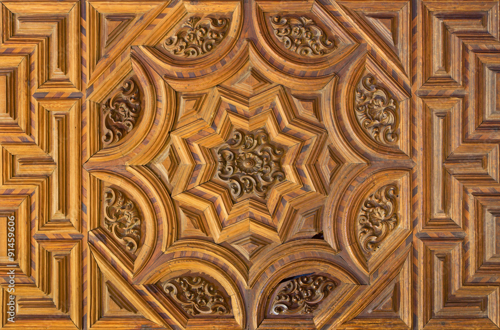 Granada - carved gate in church Iglesia del Sagrario.