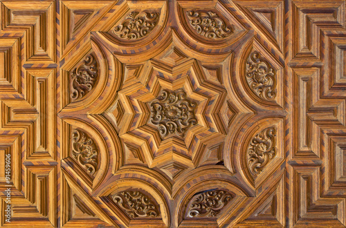 Granada - carved gate in church Iglesia del Sagrario.