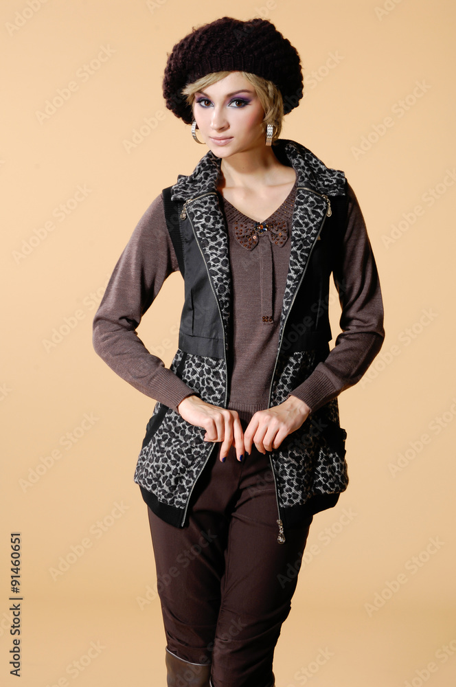 Portrait of young girl posing on beige background Portrait of young girl posing on beige background