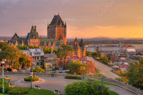 Frontenac Castle in Old Quebec City in the beautiful sunrise light. High dynamic range image. Travel, vacation, history, cityscape, nature, summer, hotels and architecture concept photo