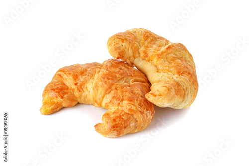golden croissant on white background