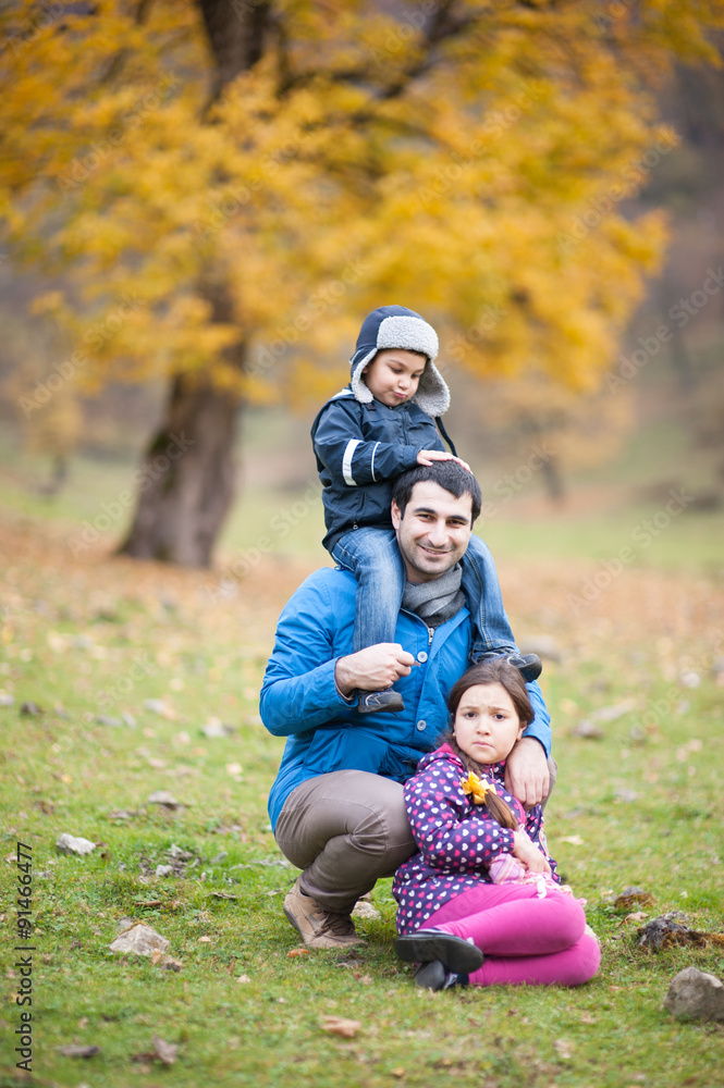 father with children in autumn mountains father with children in autumn mountains