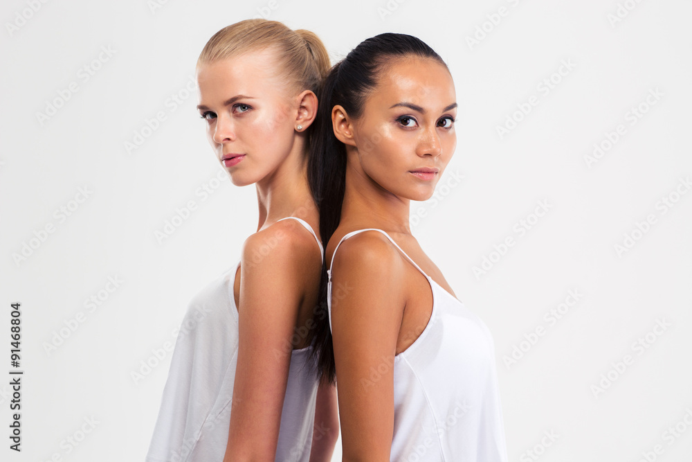 Portrait of a two pretty girls looking at camera Portrait of a two pretty girls looking at camera