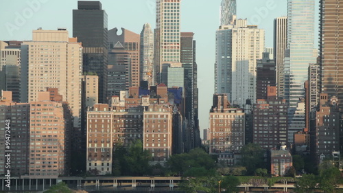 Closeup of skyscrapers and morning scene of FDR drive and East 57th Street in Midtown Manhattan, New York City, USA.