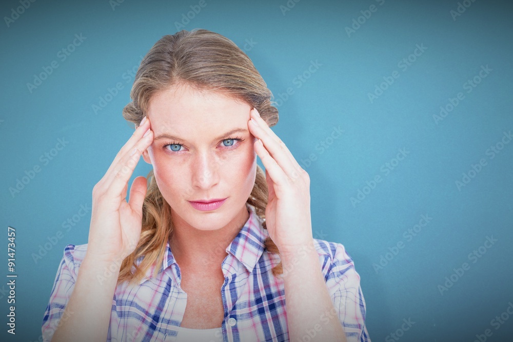Composite image of pretty hipster with headache Composite image of pretty hipster with headache