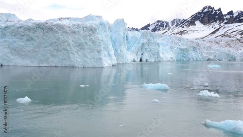 Moving by the Monacobreen Glacier in Svalbard Archipelago, Norway. photo