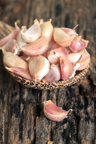 Garlic on old wooden background