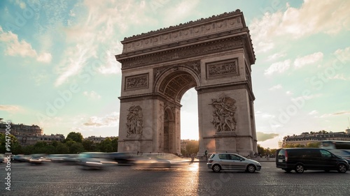 Arch Of Triumph, Evening, Paris - Time Lapse: A Time Lapse of The Arch of Triumph (Arc de Triomphe) in the evening, with cars and buses passing by in motion blur. 0h15 Timelapse. photo