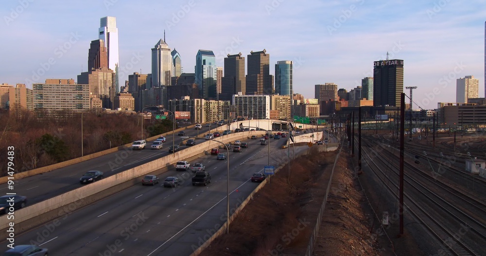 Traffic on a freeway heads into Philadelphia, PA at dusk. Traffic on a freeway heads into Philadelphia, PA at dusk.