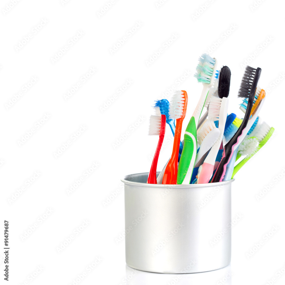 Group of old and used toothbrush in metal cup Group of old and used toothbrush in metal cup