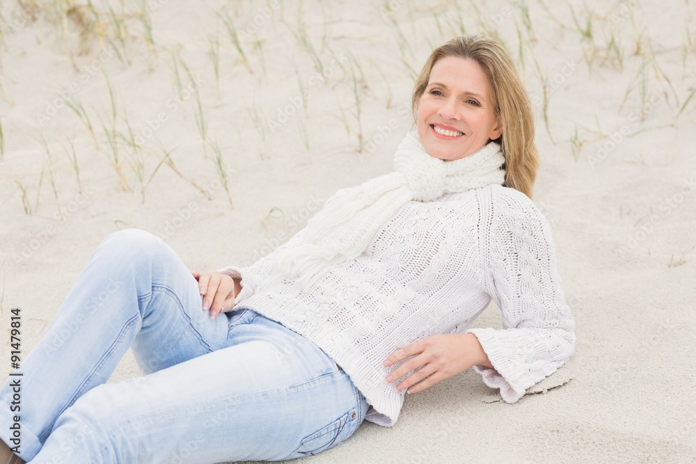 Woman lying down on the sand Woman lying down on the sand