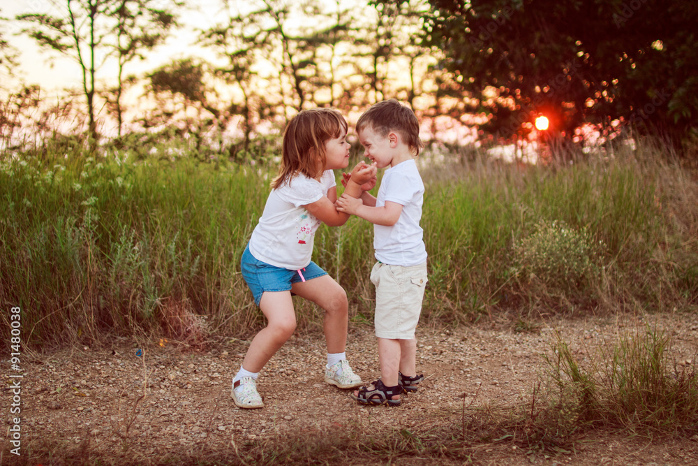 Fototapeta premium boy and girl playing 