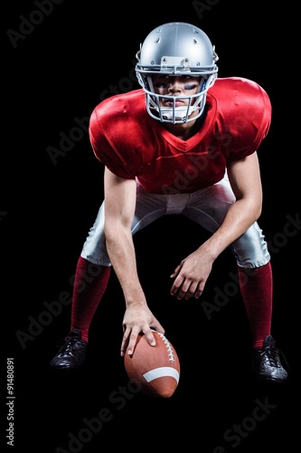 American football player placing ball while playing © WavebreakMediaMicro