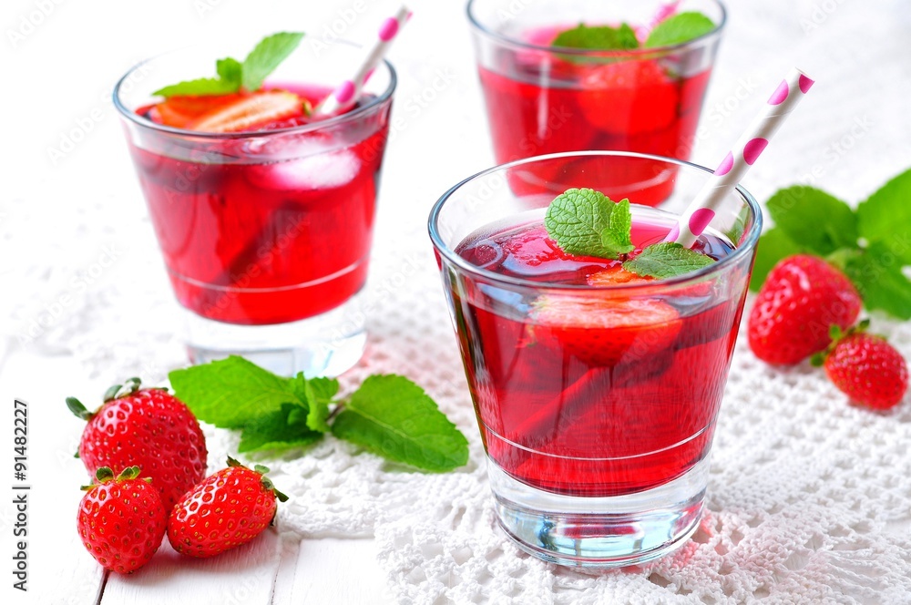homemade strawberry compote with fresh berries, mint and ice cubes homemade strawberry compote with fresh berries, mint and ice cubes