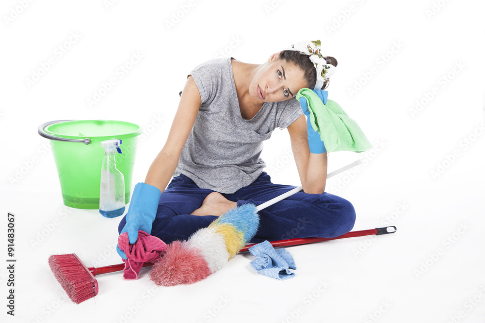 Tired frustrated and exhausted cleaning woman isolated on white Tired frustrated and exhausted cleaning woman isolated on white