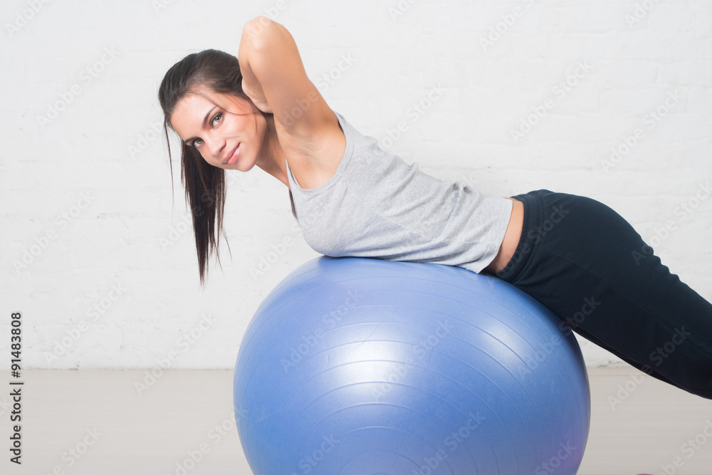 Beautiful sport woman doing fitness exercise on ball. Pilates, healthy back, sports, health Beautiful sport woman doing fitness exercise on ball. Pilates, healthy back, sports, health