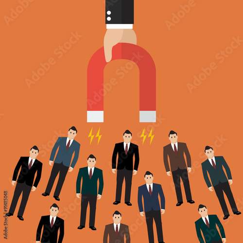 Businessman holding magnet attracting customers and clients to b