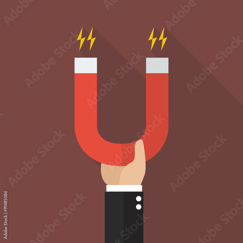 businessman holding magnet