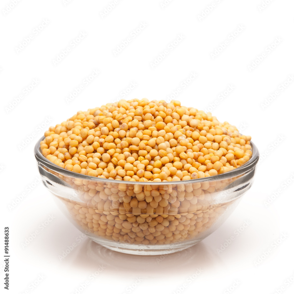Front view of Organic yellow mustard (Brassica alba) in glass bowl isolated on white background. Front view of Organic yellow mustard (Brassica alba) in glass bowl isolated on white background.