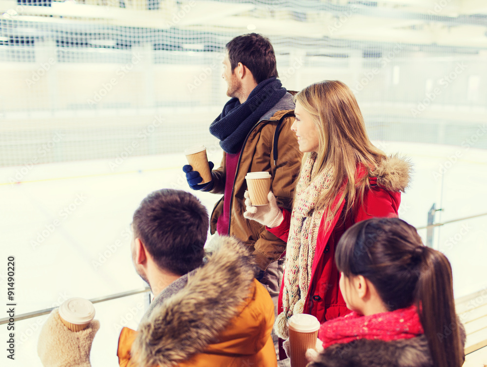 © Syda Productions - happy friends with coffee cups on skating rink © Syda Productions - happy friends with coffee cups on skating rink